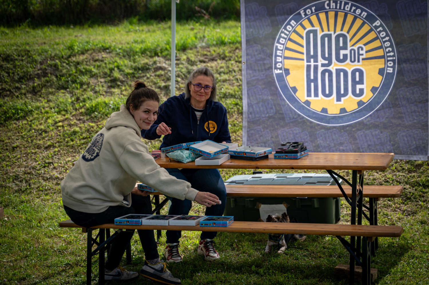 Volunteers at the Age of Hope booth